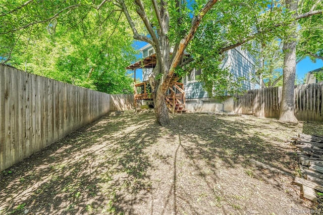 8032 Lee Ct, Arvada, CO 80005 - fenced backyard with stairs and a deck