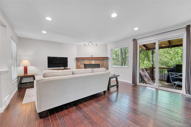 8032 Lee Ct, Arvada, CO 80005 - living area with a fireplace, dark wood-style floors, and recessed lighting