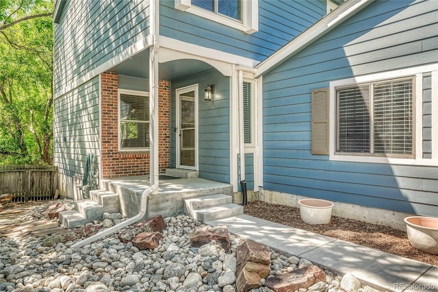 8032 Lee Ct, Arvada, CO 80005 - view of exterior entry featuring brick siding