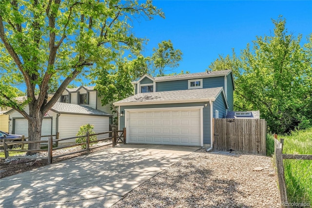 8032 Lee Ct, Arvada, CO 80005 - traditional home with a garage and driveway