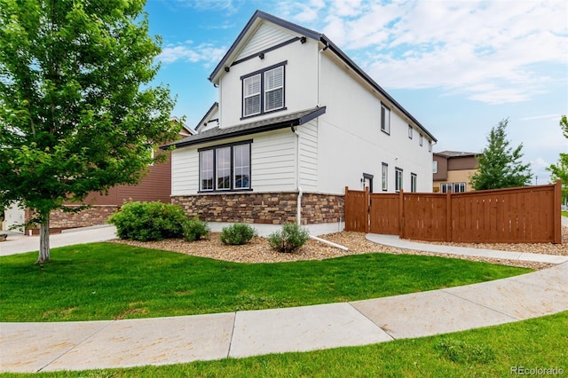 690 W 172nd Pl, Broomfield, CO 80023 - view of side of property with stone siding