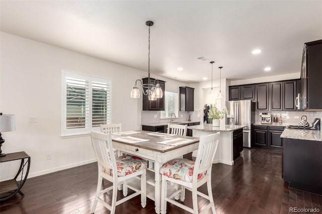 690 W 172nd Pl, Broomfield, CO 80023 - dining room featuring dark wood-style flooring, recessed lighting, and a chandelier