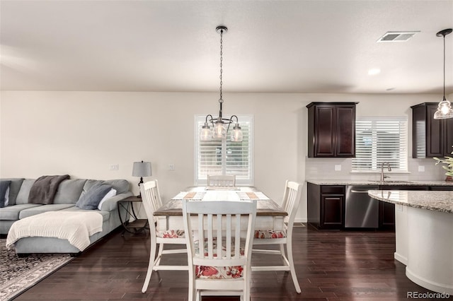 690 W 172nd Pl, Broomfield, CO 80023 - dining room with a chandelier, dark wood finished floors, and plenty of natural light