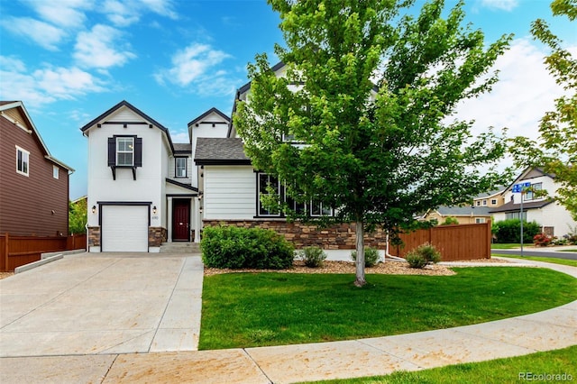 690 W 172nd Pl, Broomfield, CO 80023 - view of front of house featuring stone siding, an attached garage, and driveway