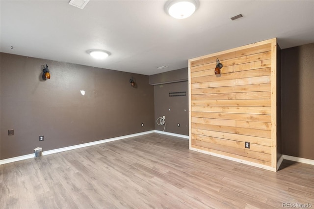 spare room with hardwood / wood-style flooring