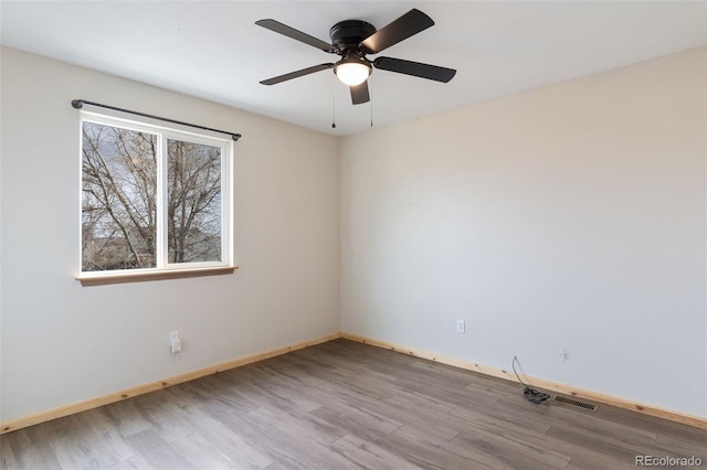 unfurnished room featuring ceiling fan and light hardwood / wood-style floors