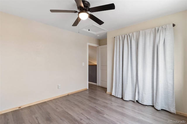 empty room featuring ceiling fan and light wood-type flooring