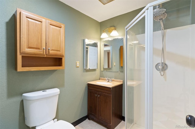 bathroom featuring vanity, toilet, and walk in shower