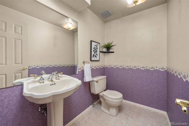 9025 Jellison Ct, Broomfield, CO 80021 - half bath with a wainscoted wall and tile patterned flooring