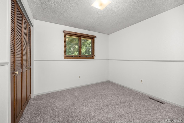 9025 Jellison Ct, Broomfield, CO 80021 - unfurnished bedroom featuring carpet flooring, a closet, and a textured ceiling