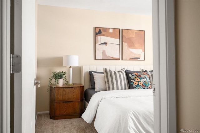 bedroom featuring carpet flooring and baseboards