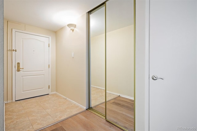 interior space with light wood-style flooring and baseboards