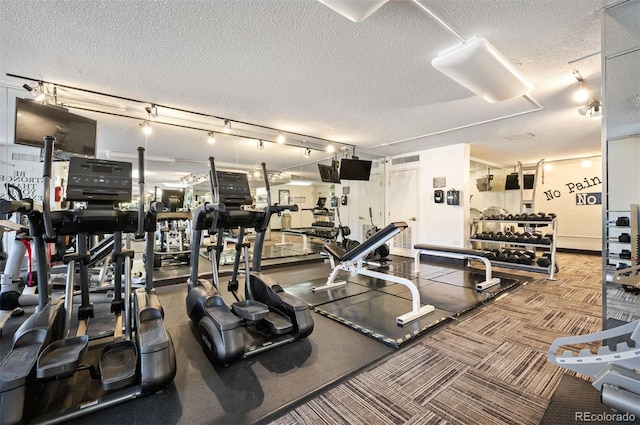gym with a textured ceiling