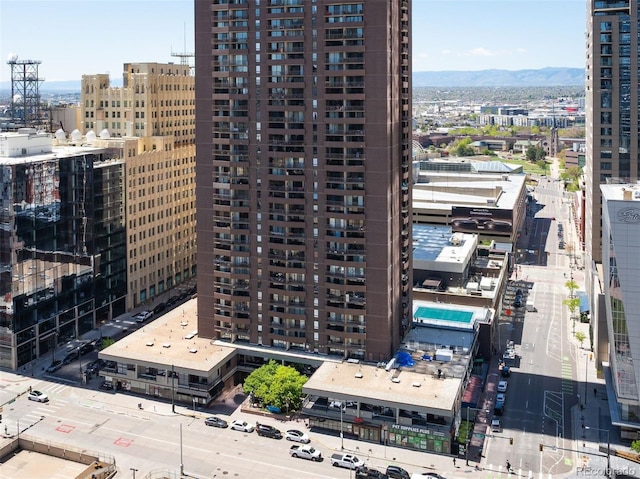 property's view of city with a mountain view
