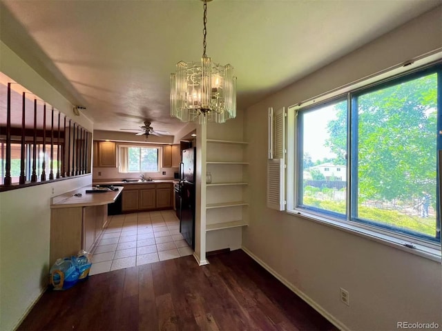 7245 S Dexter St, Centennial, CO 80122 - kitchen with a chandelier, a ceiling fan, light wood finished floors, freestanding refrigerator, and pendant lighting