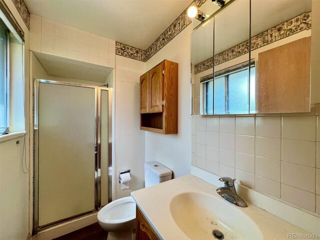 7245 S Dexter St, Centennial, CO 80122 - full bathroom featuring vanity and a shower stall