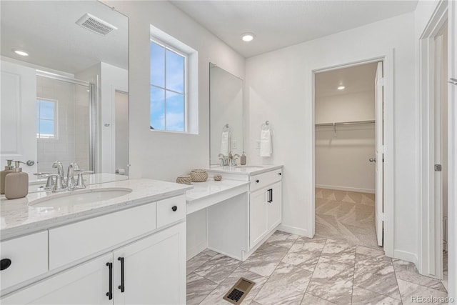 bathroom with vanity and walk in shower