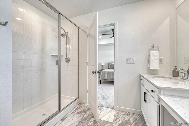 bathroom featuring vanity and a shower with shower door