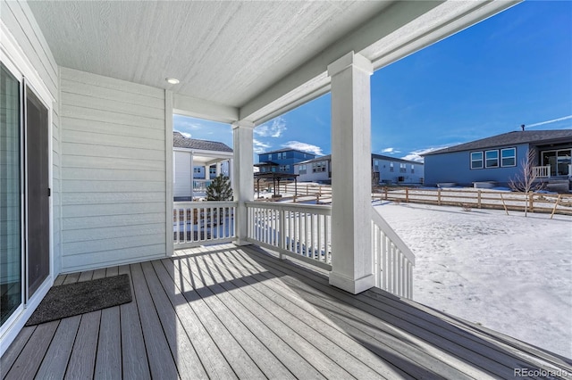 view of snow covered deck