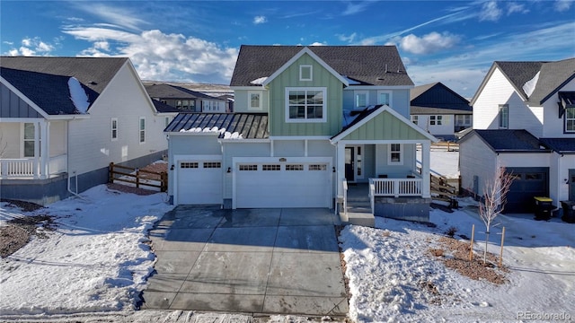 view of front of house featuring a garage and a porch