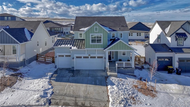 view of front of home featuring a garage and a porch