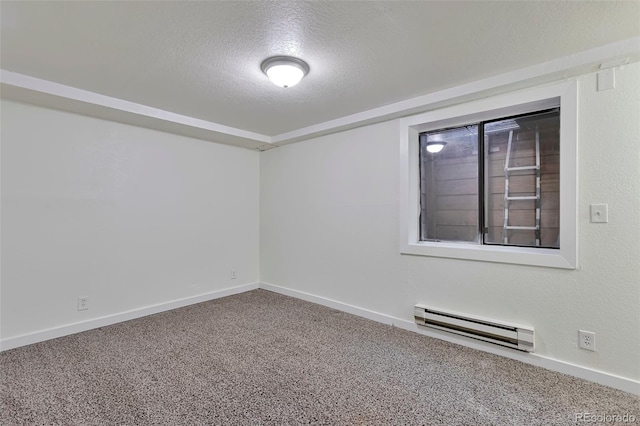 empty room with baseboard heating, carpet flooring, and a textured ceiling