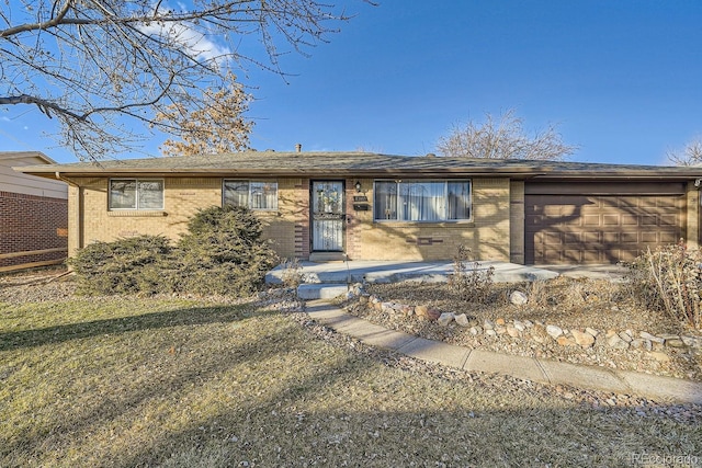 single story home with a garage and a front yard