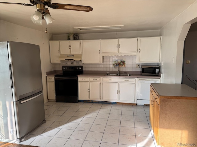 kitchen featuring white cabinetry, ceiling fan, sink, backsplash, and appliances with stainless steel finishes