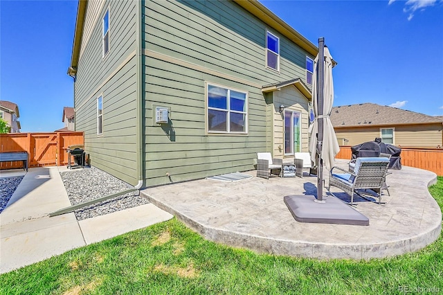 7888 E 139th Pl, Brighton, CO 80602 - back of property with a patio, a gate, and an outdoor living space
