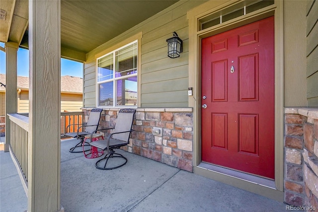 7888 E 139th Pl, Brighton, CO 80602 - property entrance with a porch and stone siding