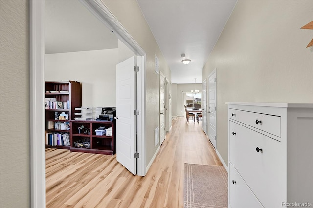 7888 E 139th Pl, Brighton, CO 80602 - hallway with light wood-style floors and baseboards