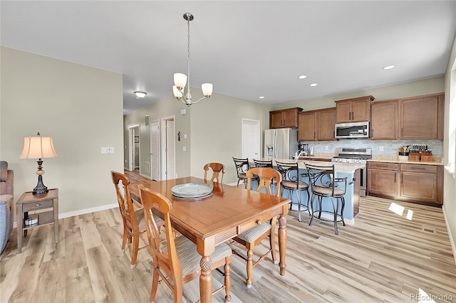 7888 E 139th Pl, Brighton, CO 80602 - dining area with light wood-type flooring, a chandelier, and recessed lighting