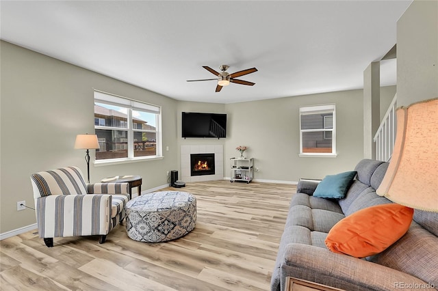 7888 E 139th Pl, Brighton, CO 80602 - living area featuring wood finished floors, ceiling fan, and a fireplace