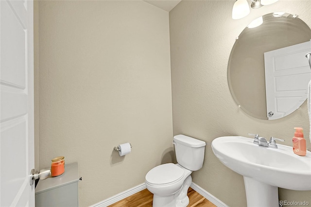 7888 E 139th Pl, Brighton, CO 80602 - half bath with wood finished floors and toilet
