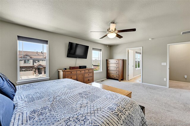 7888 E 139th Pl, Brighton, CO 80602 - bedroom featuring light carpet, a ceiling fan, and a textured ceiling