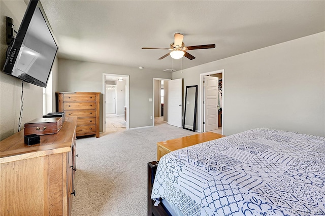 7888 E 139th Pl, Brighton, CO 80602 - bedroom featuring light carpet, a spacious closet, ensuite bath, and a ceiling fan