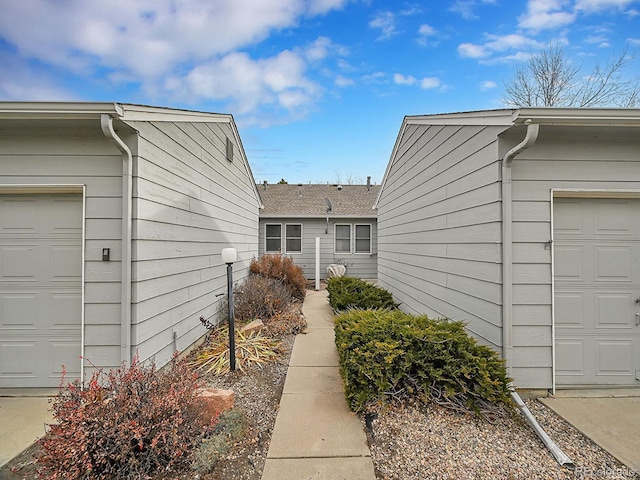 view of side of property with a garage