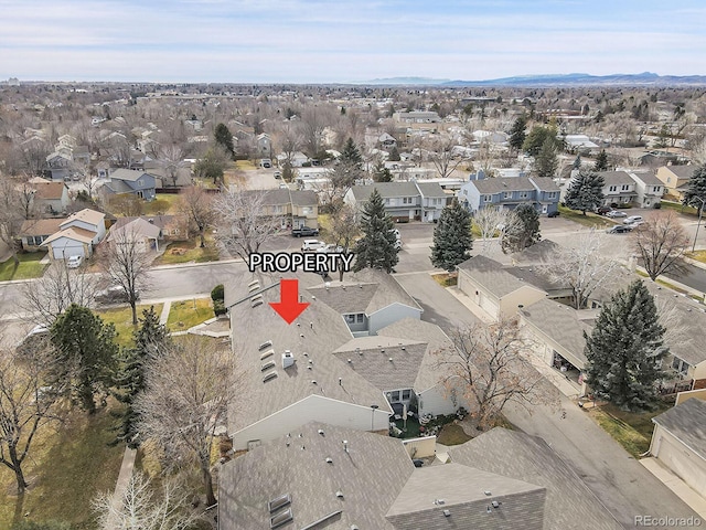 birds eye view of property with a residential view