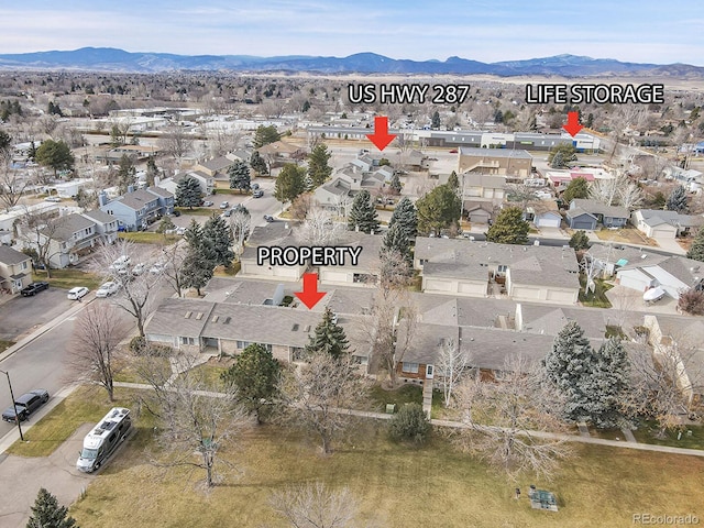 drone / aerial view with a mountain view and a residential view