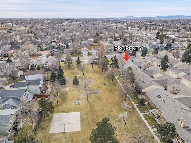 birds eye view of property with a residential view