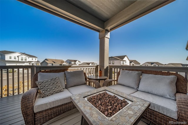 view of patio featuring a residential view and an outdoor living space with a fire pit