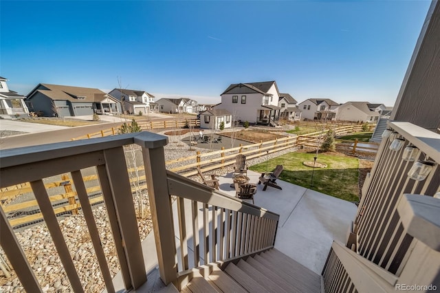 balcony with a residential view and a patio