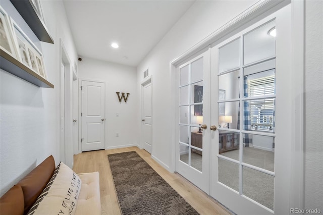 entryway with recessed lighting, visible vents, french doors, baseboards, and light wood-style flooring