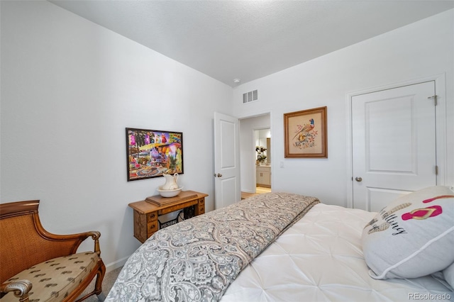 carpeted bedroom with vaulted ceiling, visible vents, and baseboards
