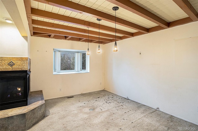 968 Terrace Cir, Colorado Springs, CO 80904 - unfurnished living room featuring wood ceiling, a multi sided fireplace, carpet flooring, and beamed ceiling