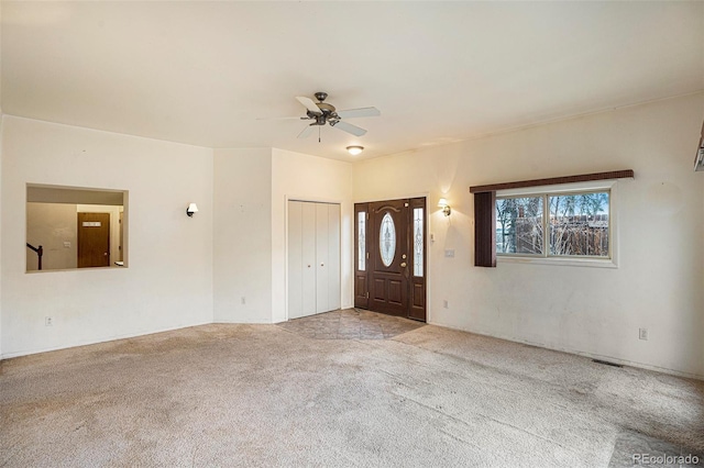 968 Terrace Cir, Colorado Springs, CO 80904 - carpeted entrance foyer featuring a healthy amount of sunlight, visible vents, and a ceiling fan