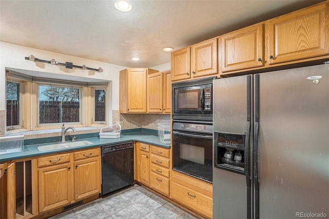 968 Terrace Cir, Colorado Springs, CO 80904 - kitchen featuring visible vents, dark countertops, recessed lighting, a sink, and black appliances