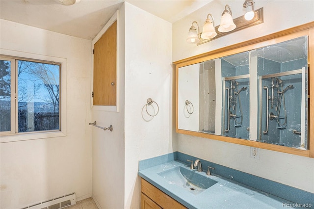 968 Terrace Cir, Colorado Springs, CO 80904 - bathroom featuring a baseboard heating unit and vanity