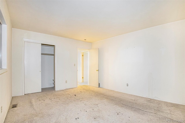 968 Terrace Cir, Colorado Springs, CO 80904 - unfurnished bedroom with a closet, carpet flooring, and visible vents