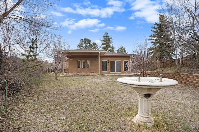 968 Terrace Cir, Colorado Springs, CO 80904 - back of property featuring a lawn and fence